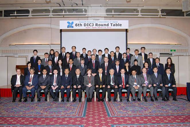 Group Photo of participants of the 6th DICJ Round Table: DICJ Governor Masanori Tanabe （7th from the right of the first row）, Deputy Governor Hiroyuki Obata （6th from the left of the first row） and CDIC Chairman David Sun （5th from the left of the first row）.